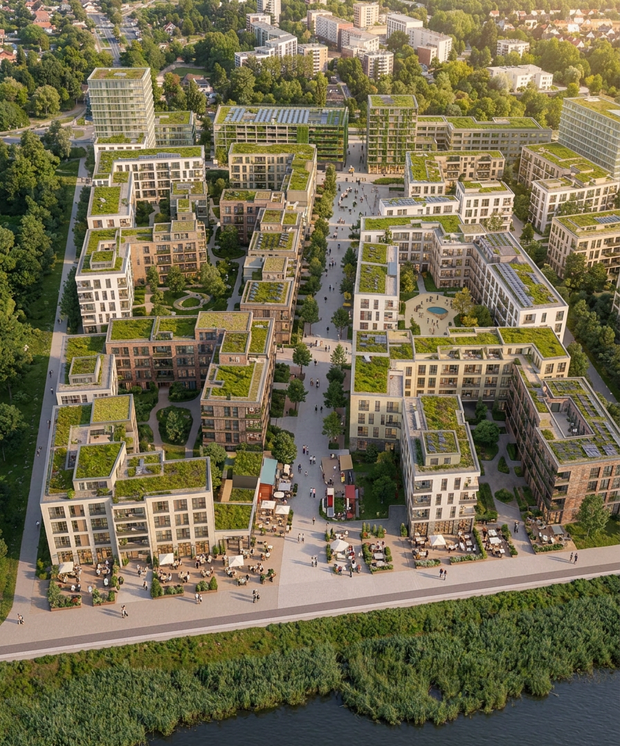 Luftaufnahme eines modernen Wohnquartiers mit begrünten Flachdächern und Innenhöfen neben einem Gewässer